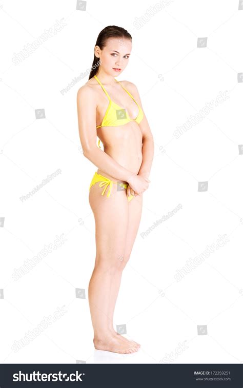 Attractive Wet Woman Yellow Bikini Isolated Stock Photo