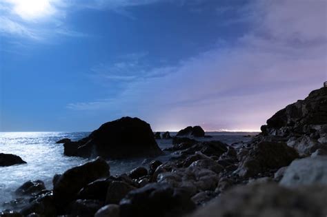 photo seaside landscape   night  rocks