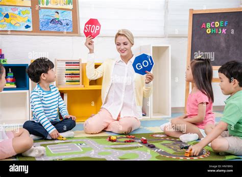 Kindergarten Children With Foreign Teacher Stock Photo Alamy