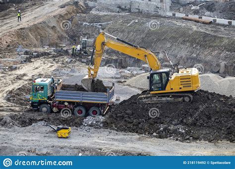 Digger Loading Trucks With Soil Stock Photo CartoonDealer 39159336