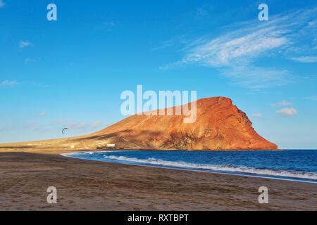 Deserted Beach Playa De La Tejita With Red Mountain Montana Roja