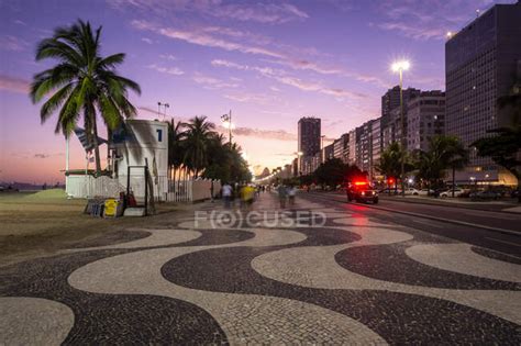 Beautiful sunset view to Copacabana Beach walk and buildings — litoral ...