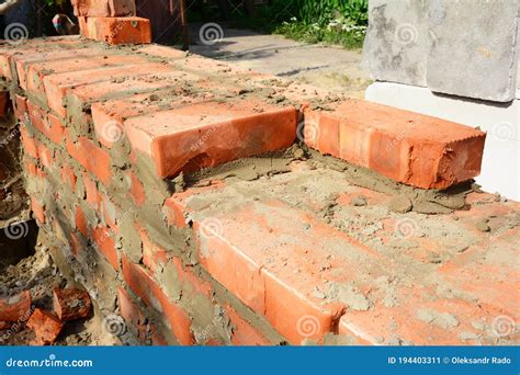 A Close Up On Bricklaying The Foundation Brickwork During New House