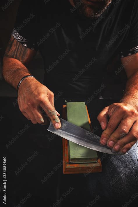 Knife sharpening process. Stock Photo | Adobe Stock