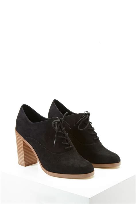 A Pair Of Faux Suede Platform Oxfords Featuring A Lace Up Front Almond Toe And A Block Heel