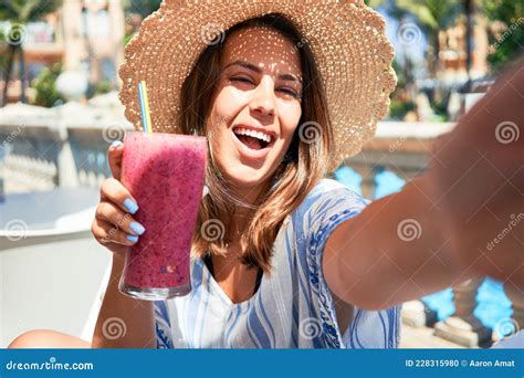 Beutiful Woman Sitting At Pool Bar On Hotel Resort Drinking Healthy