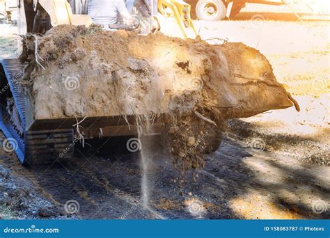 Close Up Of Bulldozer Scoop Moving Earth Landscaping Works Stock Image