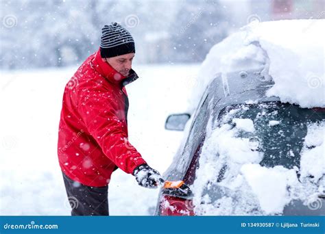 Cleaning Car From Snow Men Cleaning Car Windshield From Snow And Ice