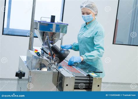 Pharmacy Industry Woman Worker In Protective Clothing Operating