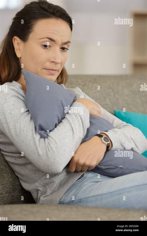 Sad Woman Hugging A Pillow Stock Photo Alamy