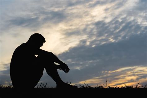 Premium Photo Silhouette Of A Man Sitdown With So Sad In The Sunset