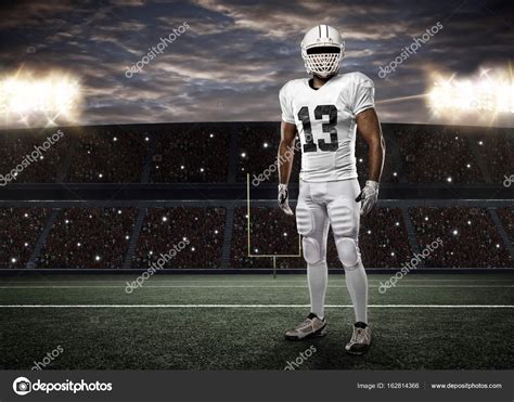 Football Player with a white uniform Stock Photo by ©betochagas 162814366