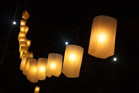 Premium Photo | Illuminated lantern hanging at night