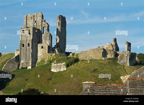 Corfe Castle Ruins above Corfe Castle Village, Dorset, UK Stock Photo ...