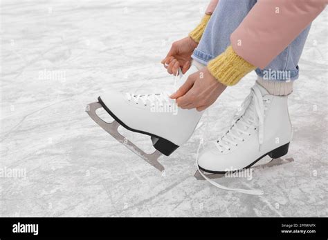 Woman Lacing Figure Skates On Ice Closeup Stock Photo Alamy