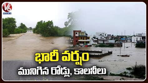 Roads And Colonies Submerged With Flood Water In Mancherial People In