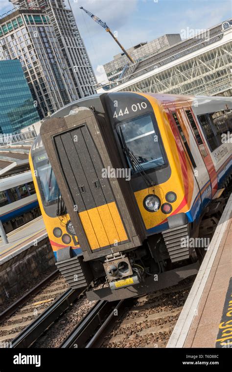 A South Western Railway Class 444 Electric Multiple Unit Commuter Train In A Platform At London