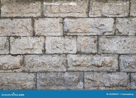 Textura De La Pared Gris Vieja Con El Revestimiento De Piedra Imagen De