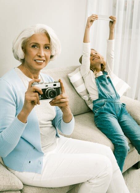 Premium Photo Grandmother And Granddaughter Having Fun Showing Theirs