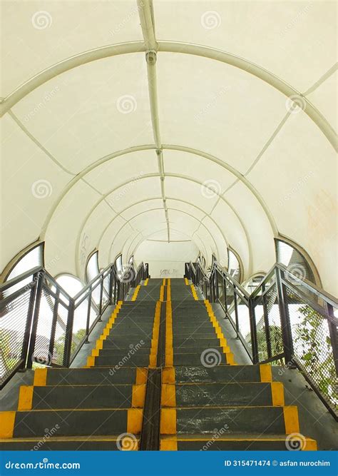 Pedestrian Bridge with Tunnel Style Design. Stock Photo - Image of ...