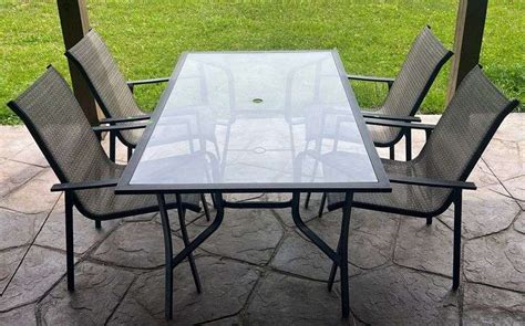 Glass Top Patio Table 40”x66” And 4 Metal Frame Patio Chairs With Mesh Seats Metzger Property