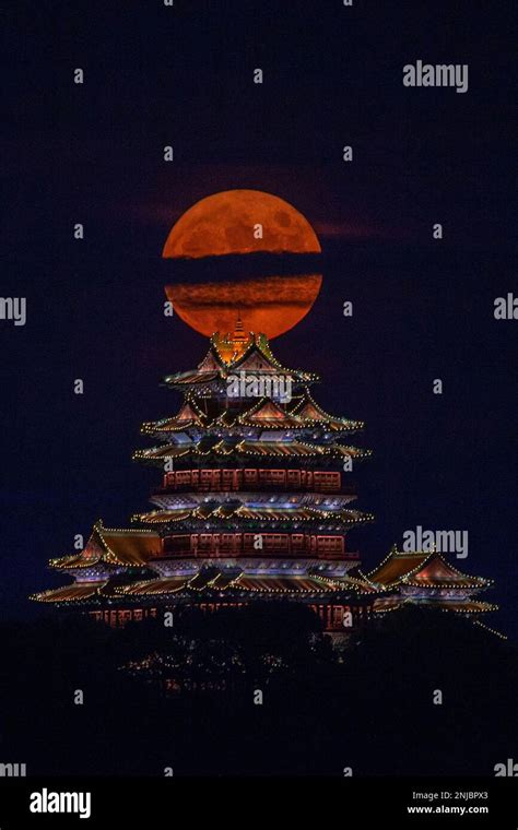 A View Of The Full Moon Rising Behind The Ming Style Yuejiang Tower In