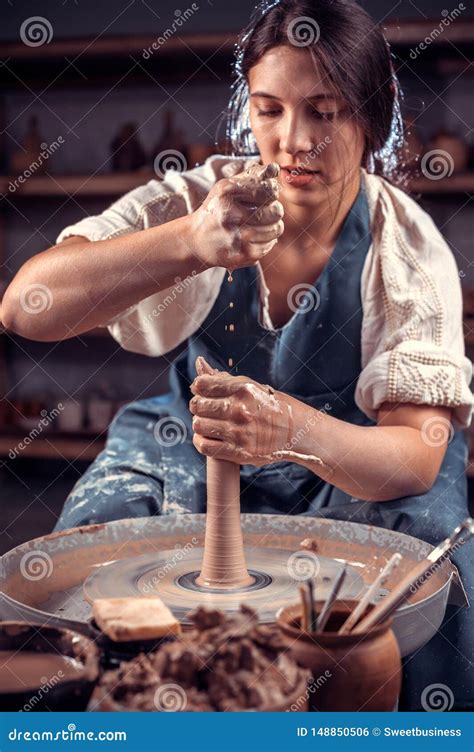 Beautiful Artisan Woman Working On Potter S Wheel With Raw Clay With