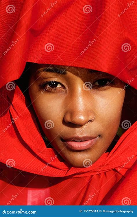 Attractive Young African Woman In Beautiful Headdress Stock Photo