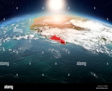 Sunrise Above Liberia Highlighted In Red On Model Of Planet Earth In