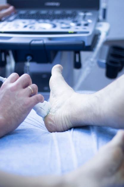 Premium Photo Close Up Of Doctor Applying Medicine On Patient Foot In