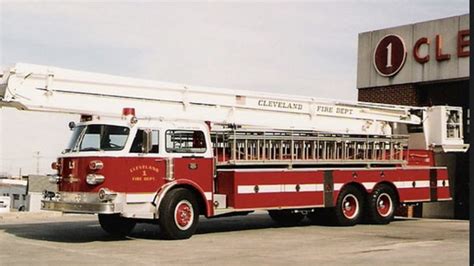 A Red Fire Truck Parked In Front Of A Building