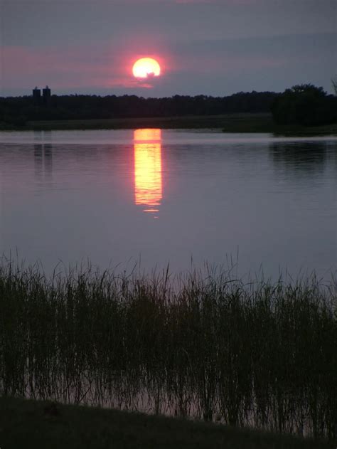 Sunset over the Rainy River. The Rainy River is the natural border ...