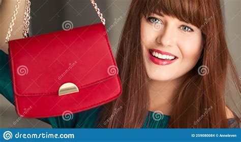 Fashion And Accessories Happy Beautiful Woman Holding Small Red Handbag With Golden Details As