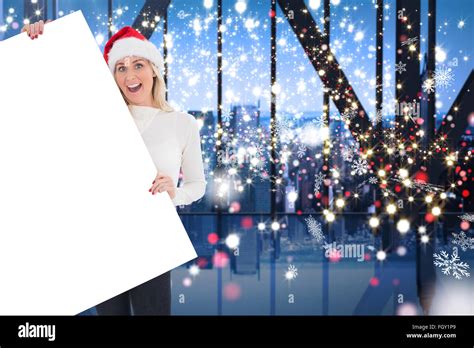 Composite Image Of Festive Blonde Showing Poster Stock Photo Alamy