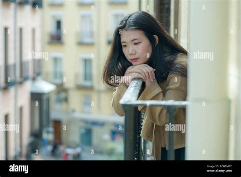 Dramatic Portrait Of Young Beautiful Sad And Depressed Asian Japanese