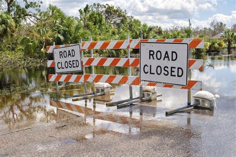 Road Closed for Roadworks and Danger of Flooding with Warning Signs ...