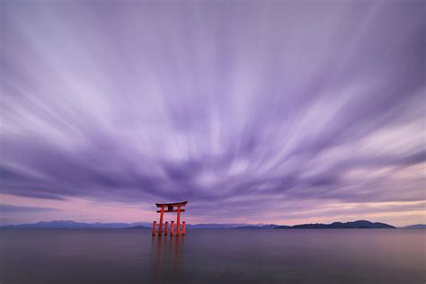 Long Exposure Shot Of Shirahige Shrine Torii Gate At Sunset At Lake