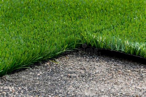 Closeup Installation of Football Field with Artificial Turf with Grass ...