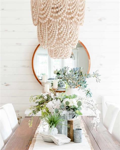 White Chandelier Over a Rustic Table - Soul & Lane