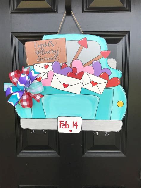 A Door Hanger That Has Been Decorated With Mail And Hearts On The Back