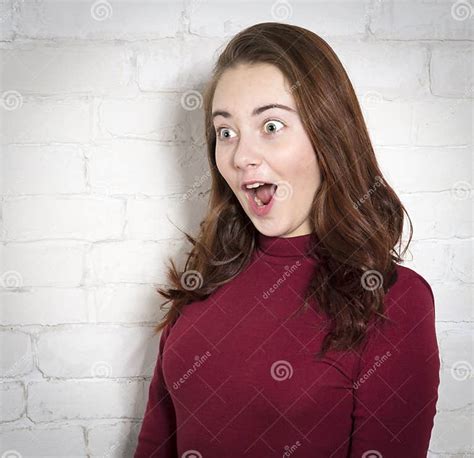 Young Beautiful Woman Portrait On White Brick Wall Background Stock