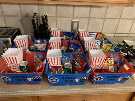 Several Red And Blue Containers Filled With Snacks