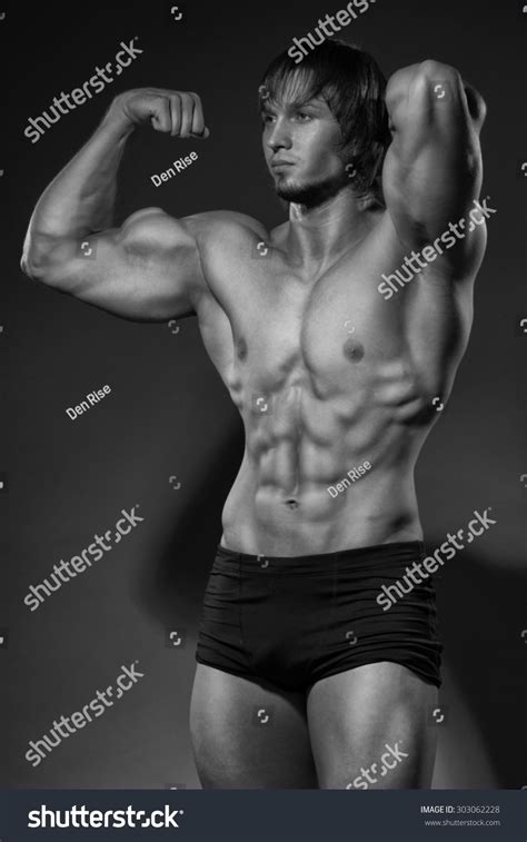 Bodybuilder Showing His Back Biceps Muscles Stock Photo 303062228 ...