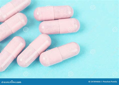 Pink Capsule Pills on Blue Background Stock Photo - Image of beauty, breast: 247894666