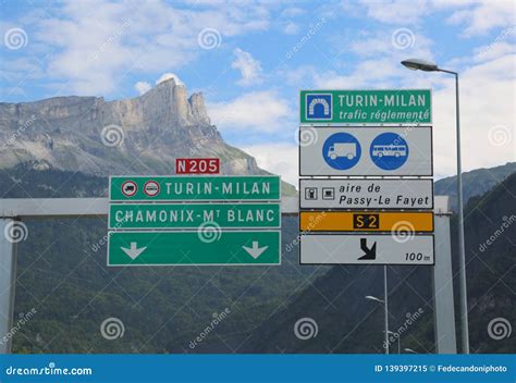 Road Sign on the Border between Italy and France and Directions Stock ...