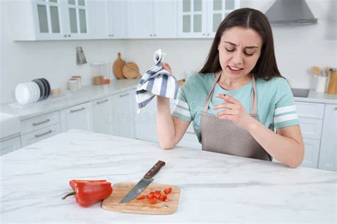 Woman Cut Finger with Knife while Cooking Stock Photo - Image of chef ...