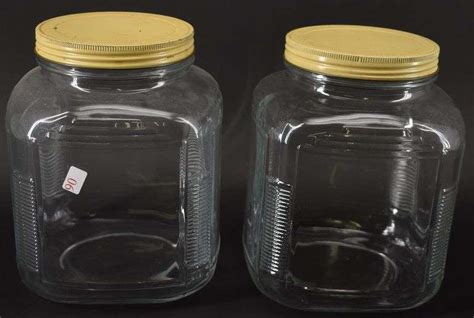 2 Glass Jars w/ Original Lids - BHD Auctions