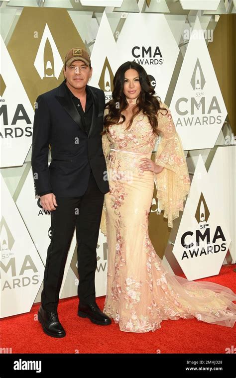 Rodney Atkins Left And Rose Falcon Arrive At The 53rd Annual Cma Awards At Bridgestone Arena