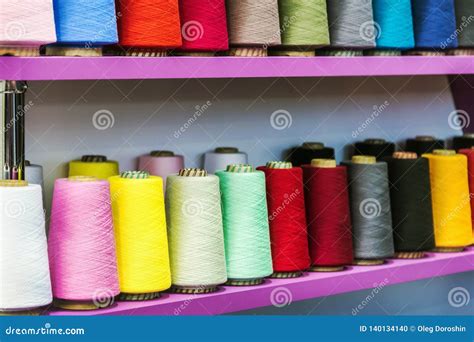 Different Color Spools Of Thread For The Textile Industry Stock Photo