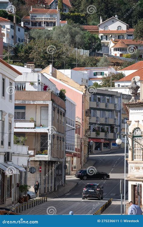 Vertical Shot Of A Steep Road With Cars And Residential Buildings In